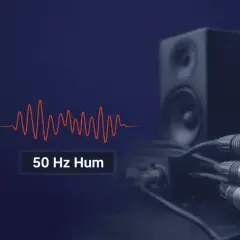 Onda sonora de 50 Hz y cables de audio conectados a altavoces, sugiriendo problemas de ground loops.
